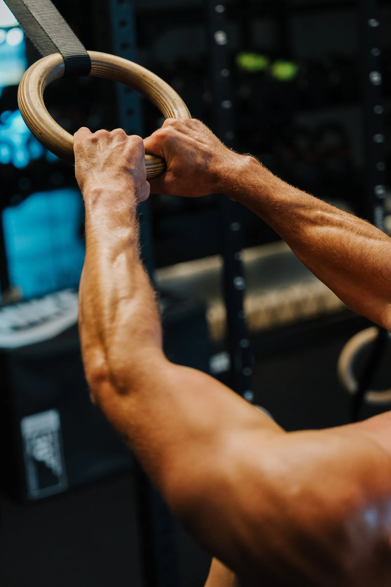 Hands gripping a gymnastics ring