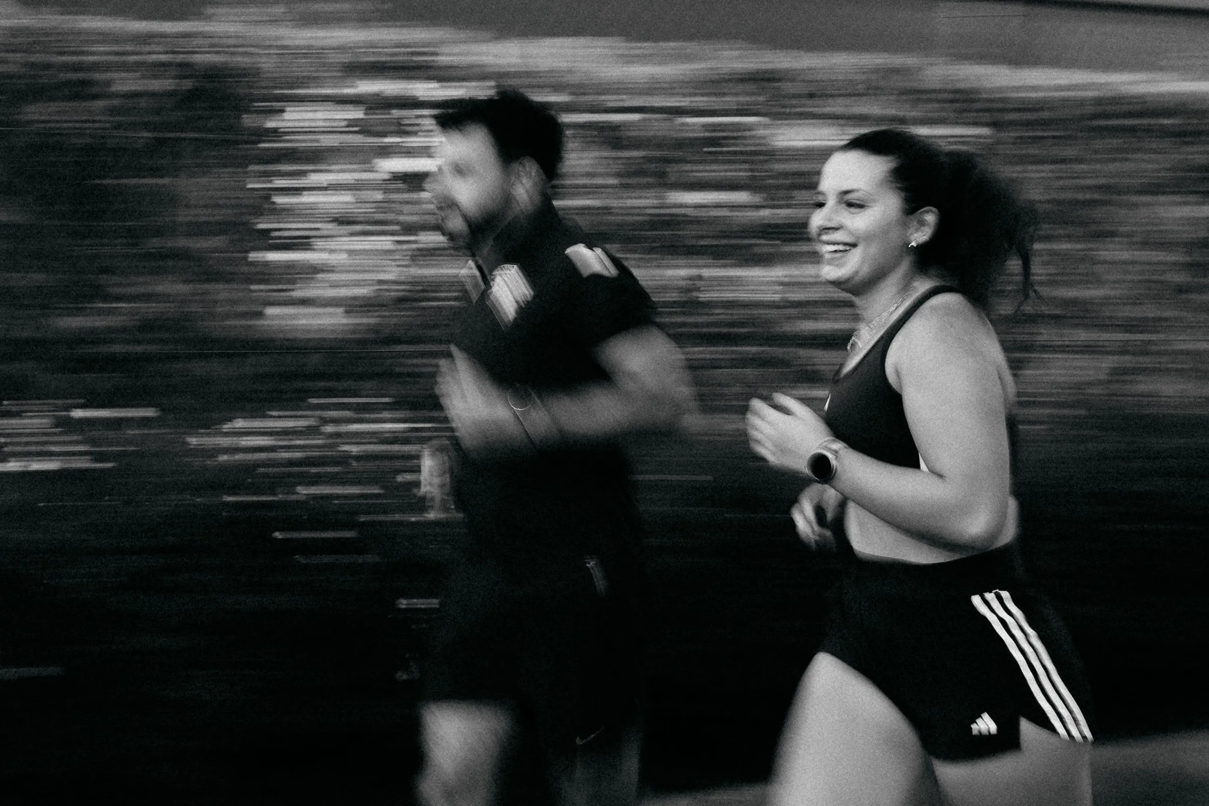 Two runners in motion, black and white