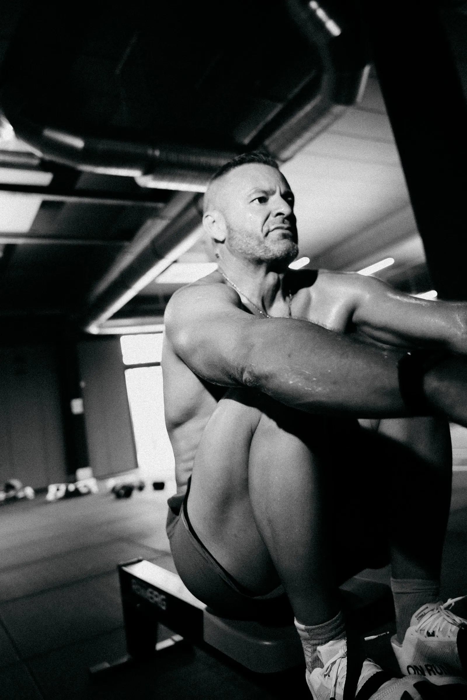 Athlete on a rowing machine, black and white